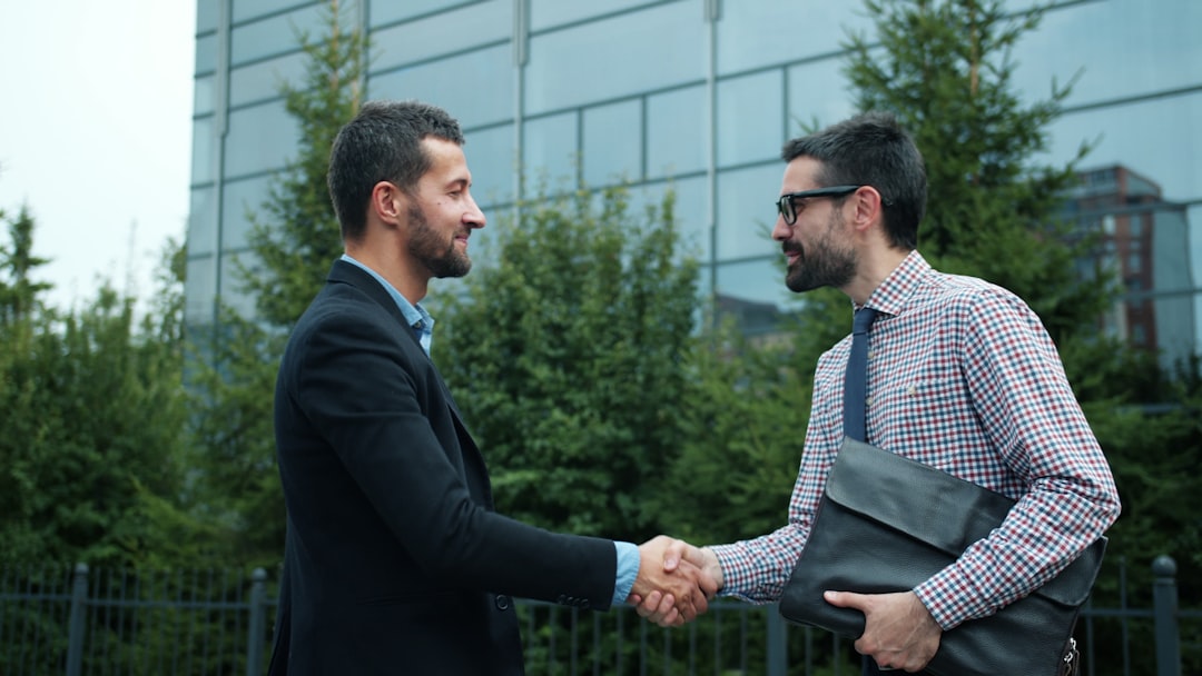 Business professionals shaking hands